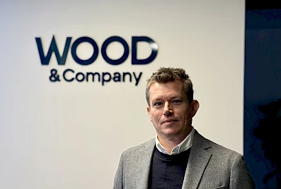 Realitný tím skupiny WOOD & Co. posilňuje menovec, riaditeľ investičnej stratégie Philip Wood.